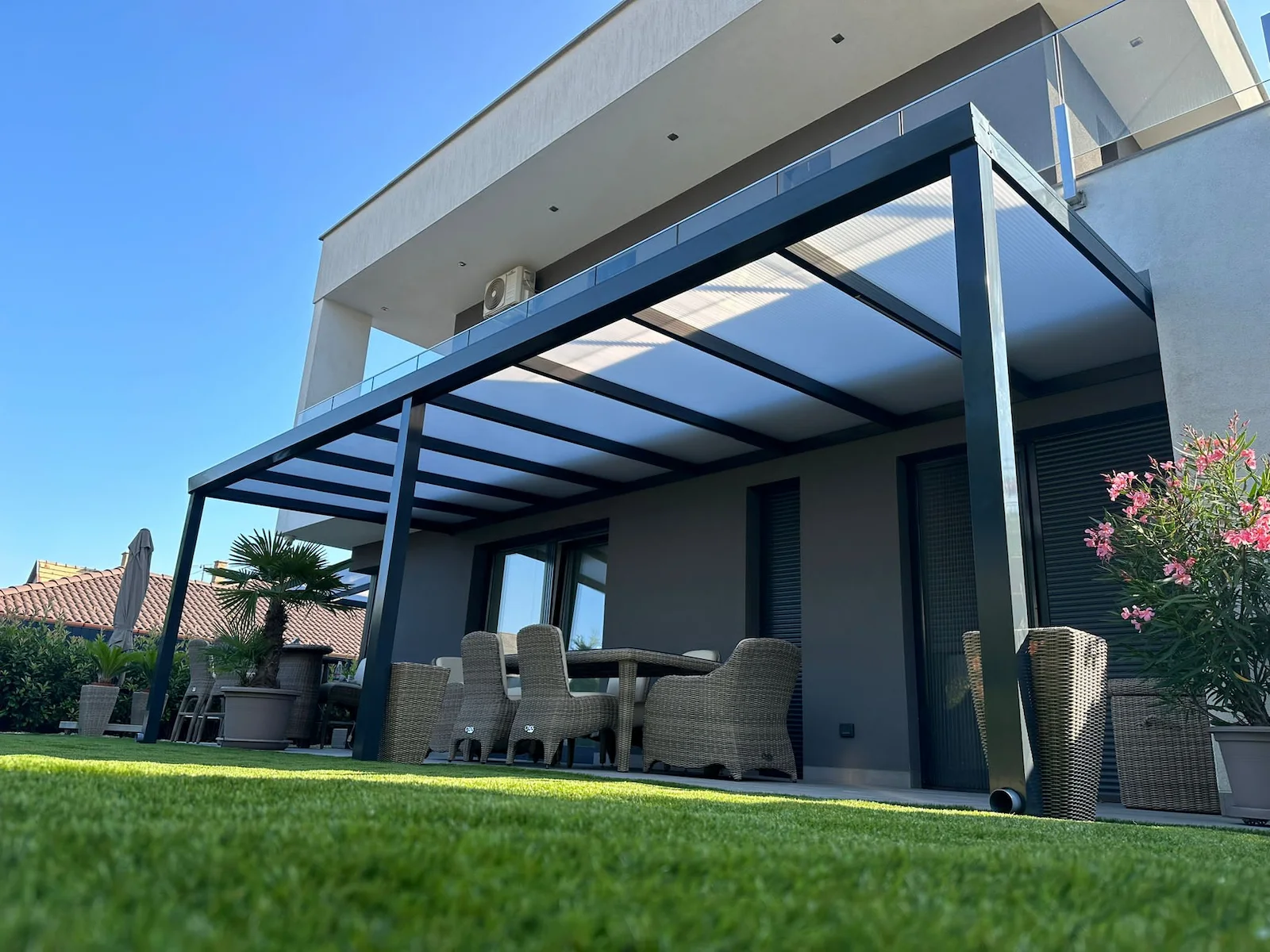 Custom aluminium pergola installed beside a modern terrace