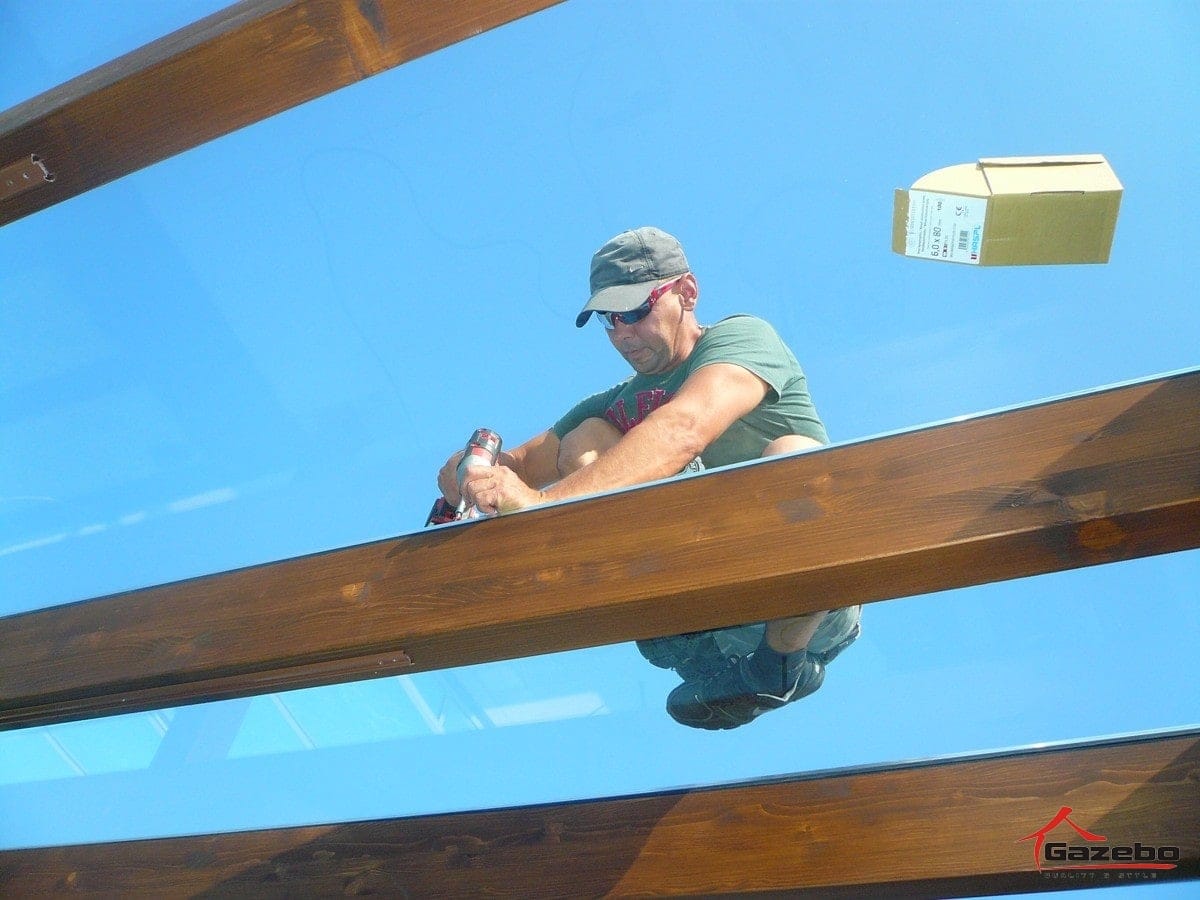 Laying glass onto the Milano wooden pergola