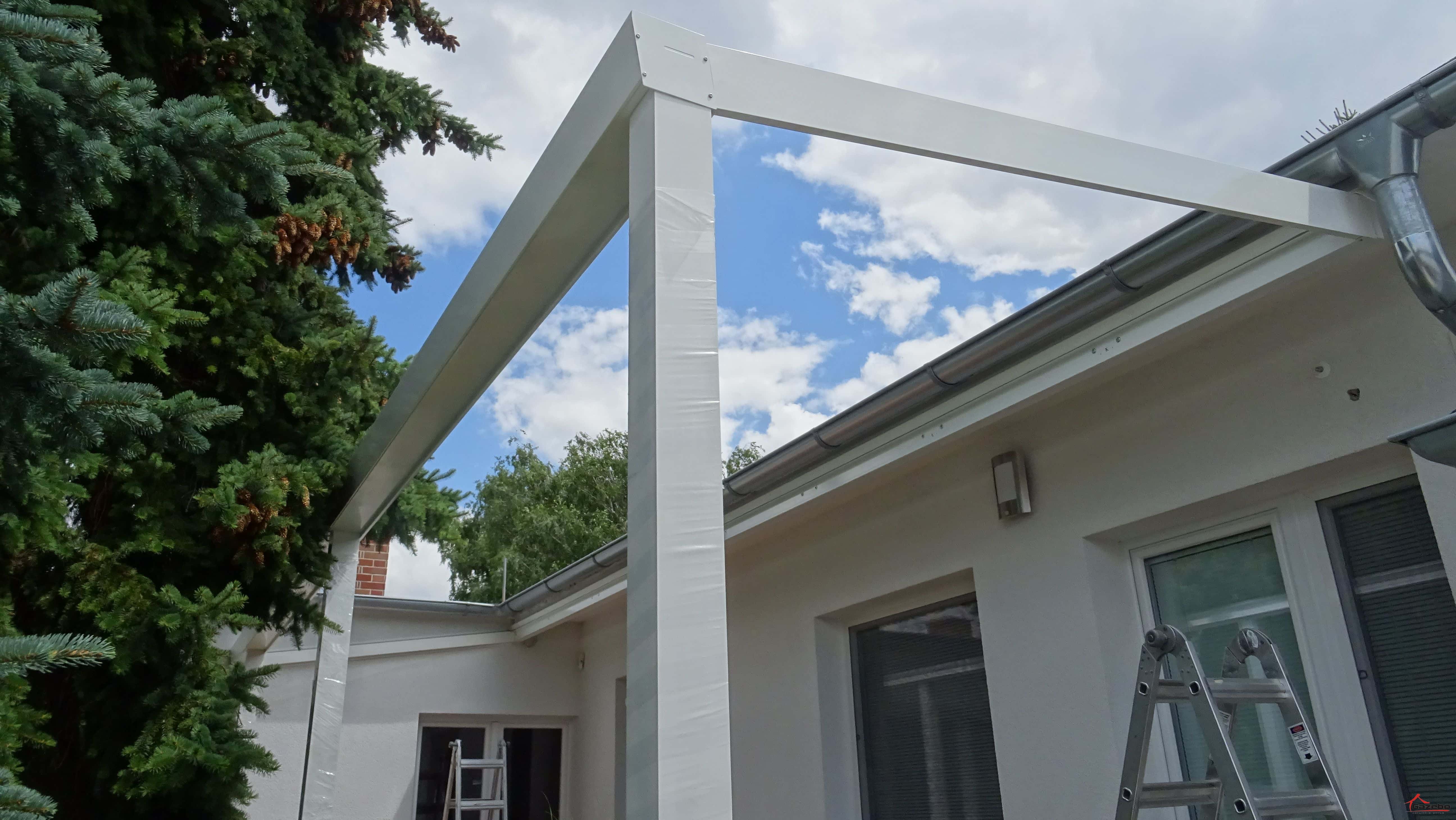 White aluminium pergola during the shelter rebuild