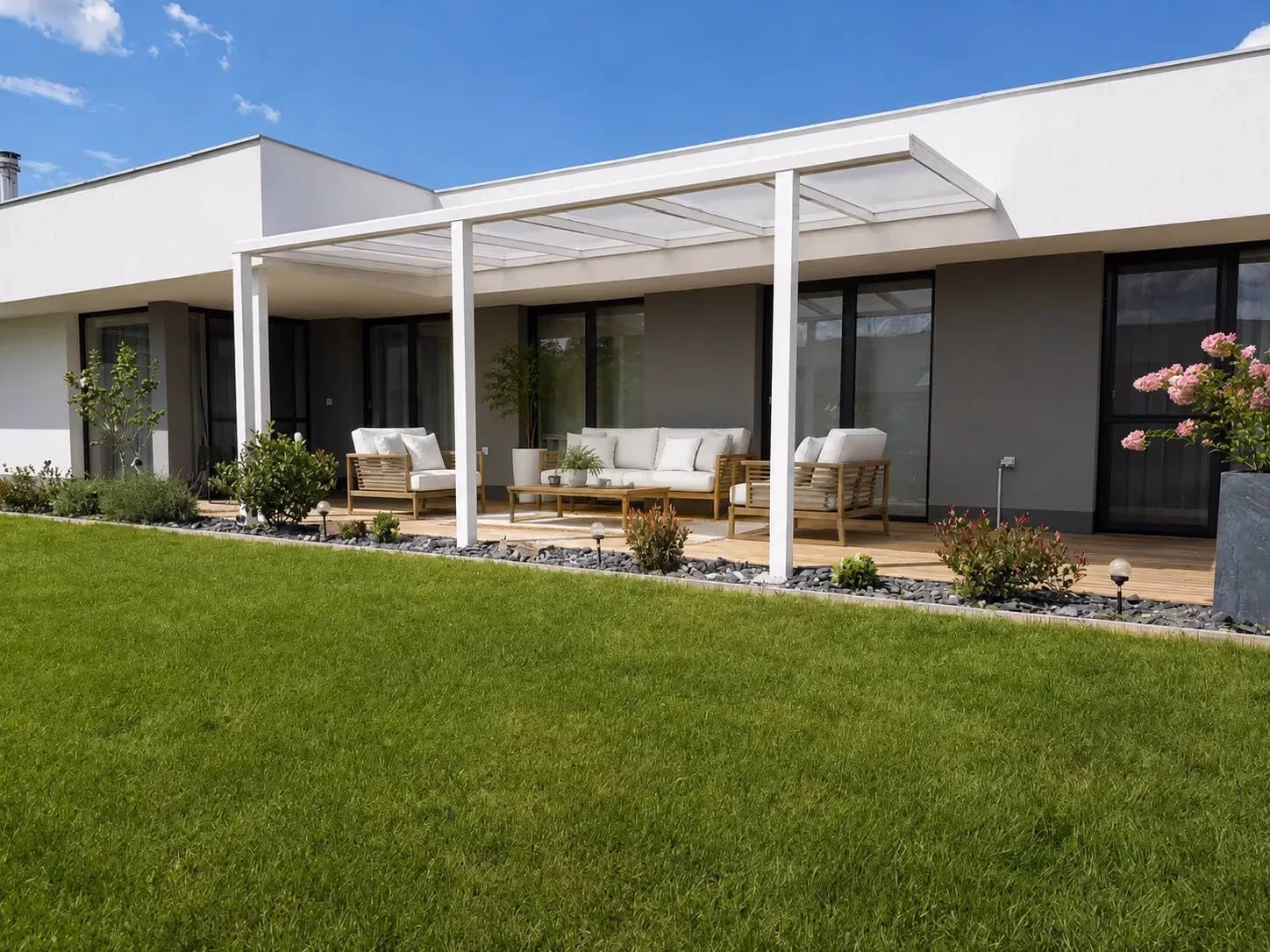 White Basic Class aluminium pergola with a glass roof beside a modern house