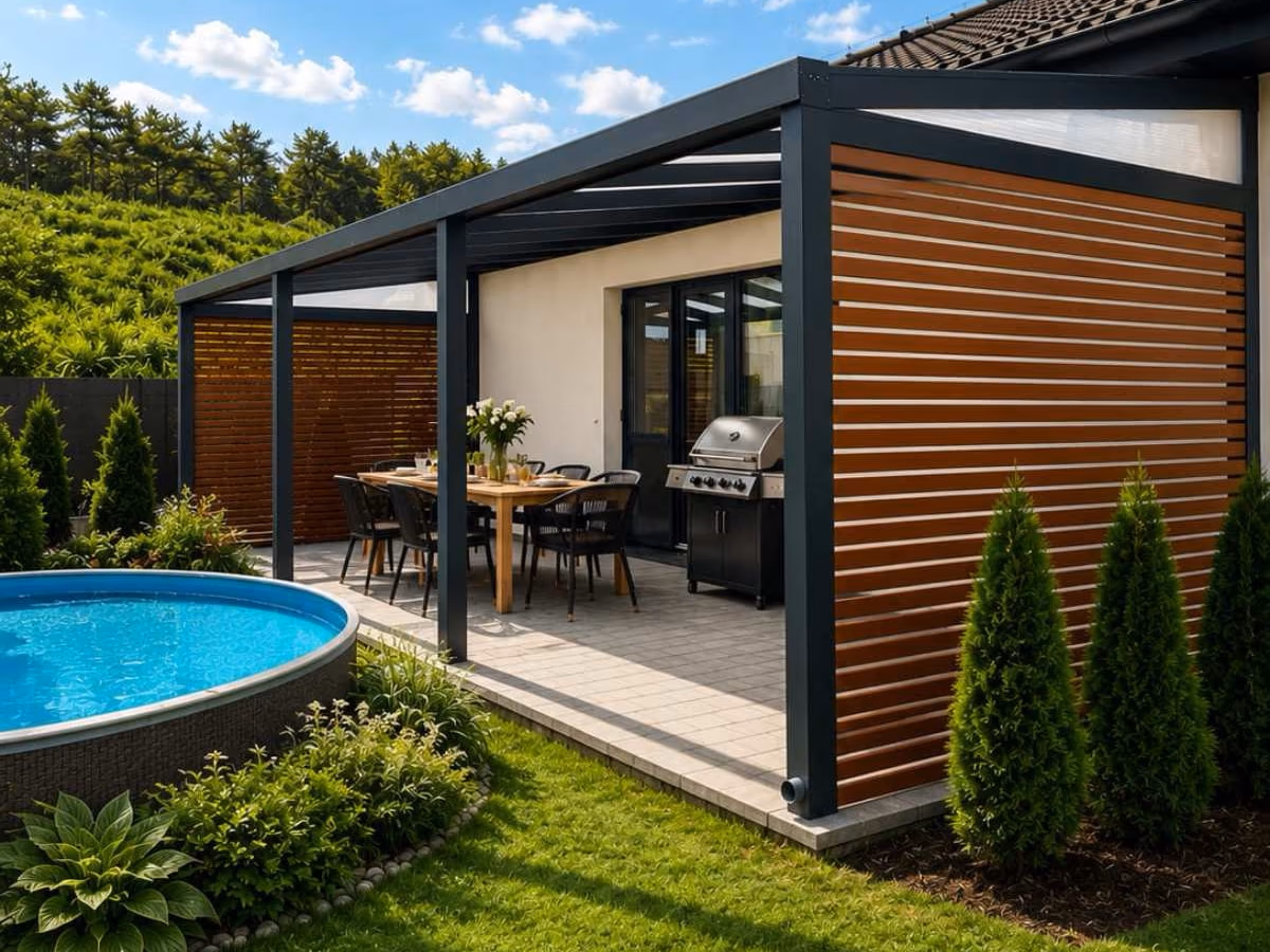 Economic Class aluminium pergola with wooden side screens, an outdoor dining area and grill next to a pool