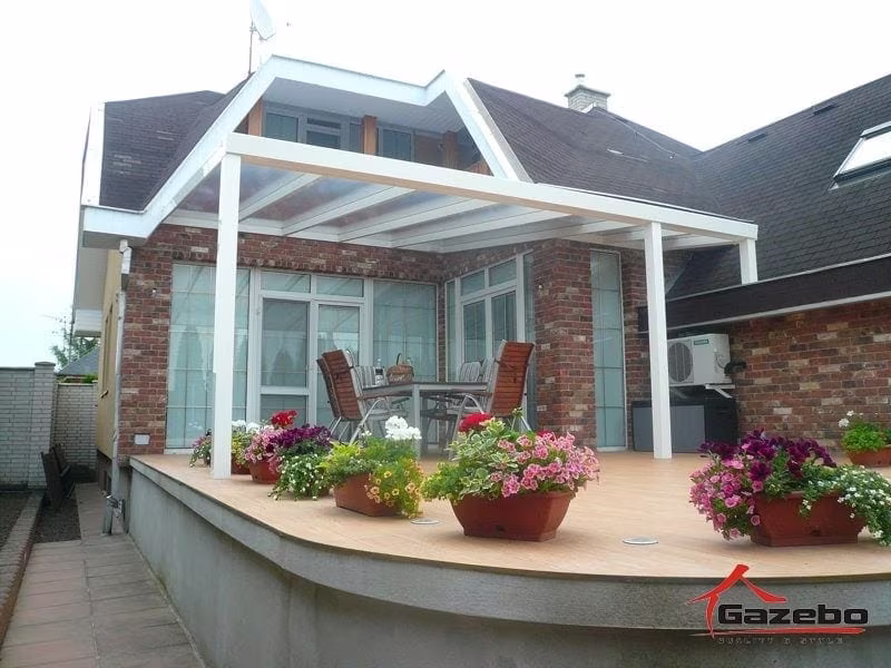 White Economic Class aluminium pergola on a raised brick terrace with flower boxes