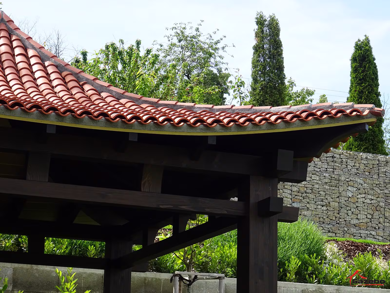 Detail of the curved ceramic roof of the Hinode wooden gazebo