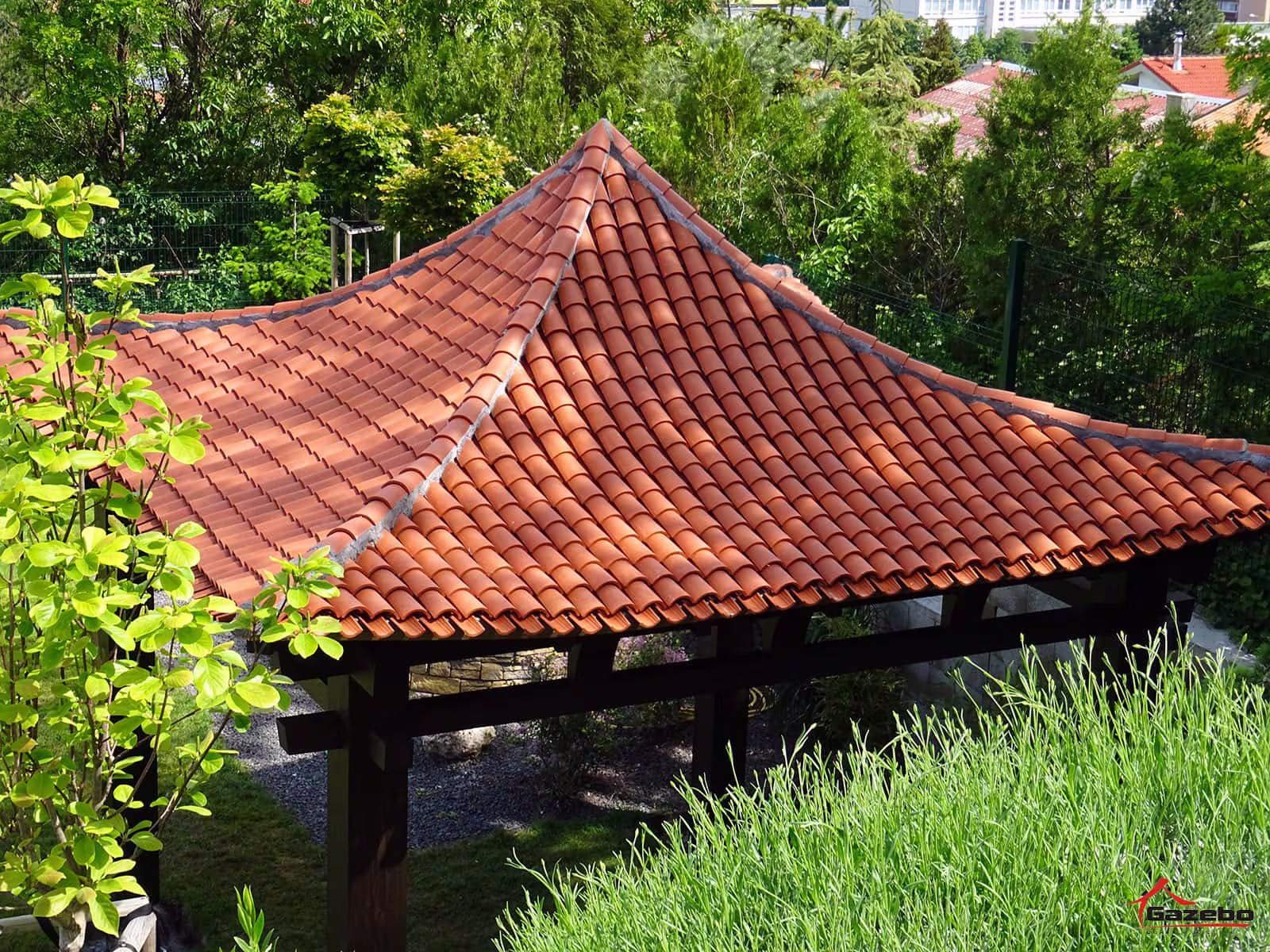 Hinode wooden gazebo with ceramic roof in a family home garden