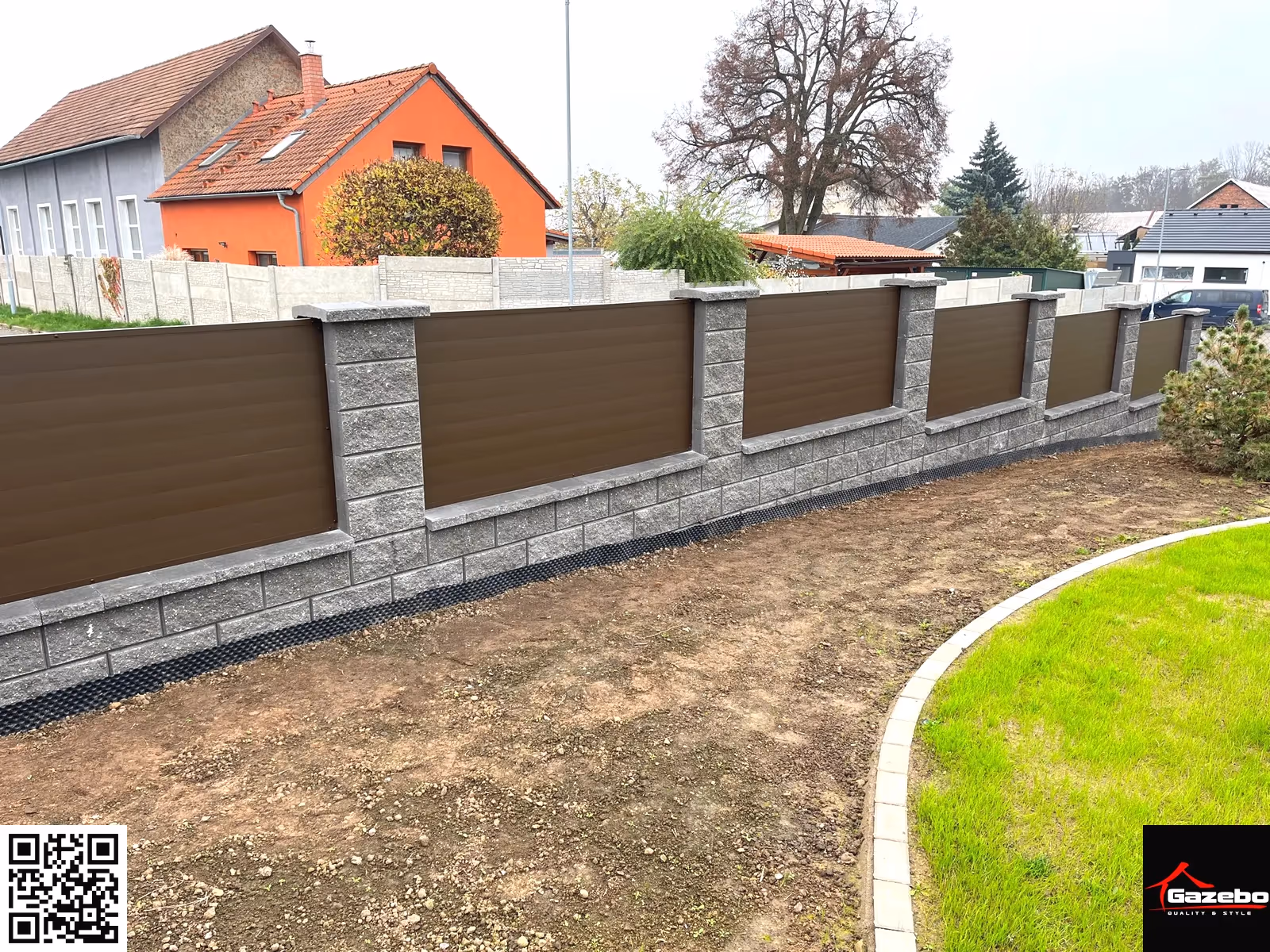 Modern aluminium fence in a brown woodgrain finish on stone pillars