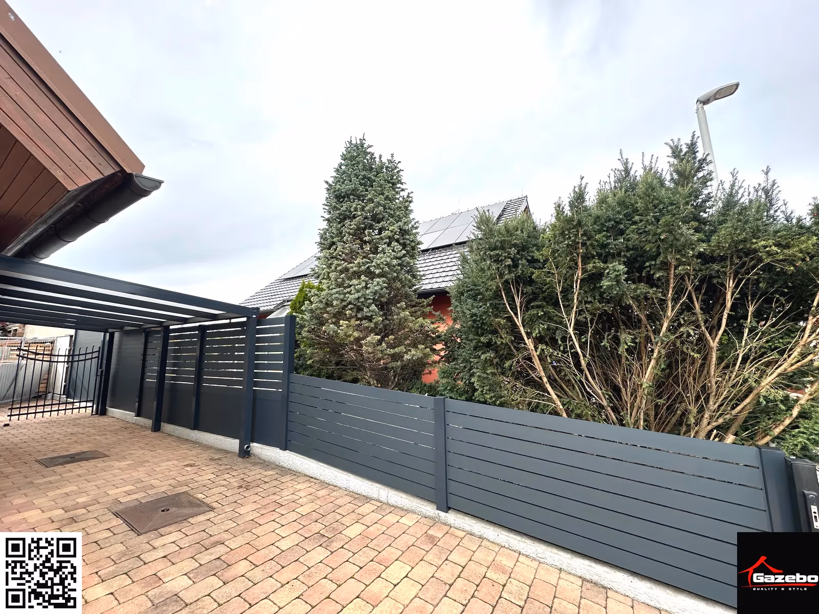 Modern aluminium fence with a gate in matching design