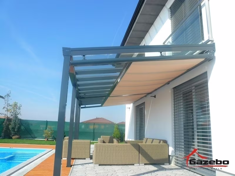 Anthracite Top Class aluminium pergola with rattan seating by a pool