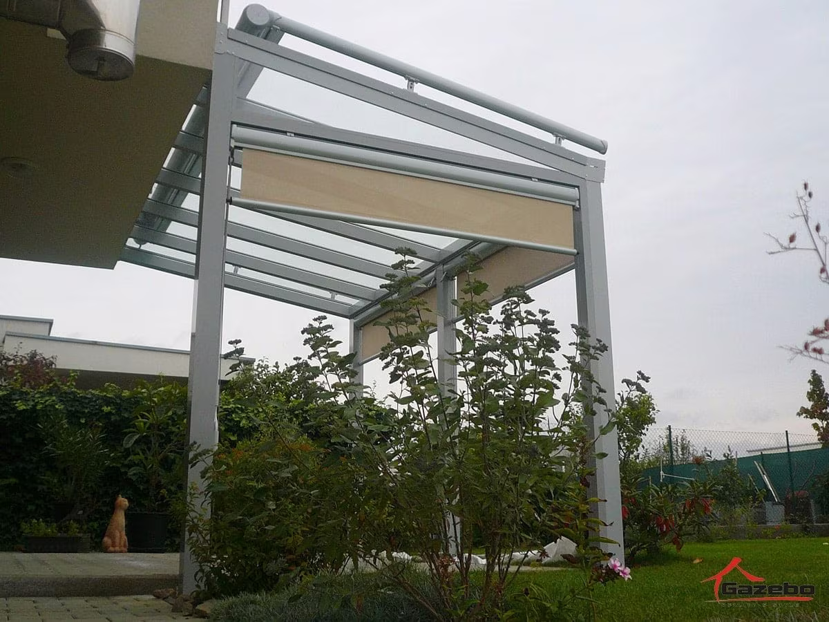 White Top Class aluminium pergola with front shading over a terrace in a garden