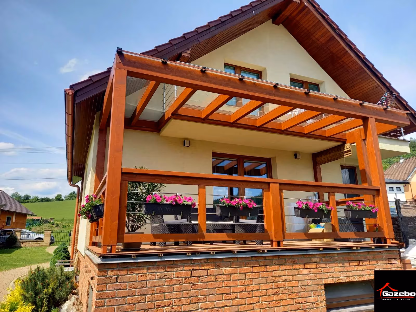 Milano wooden pergola beside a gable-roofed house with flowers