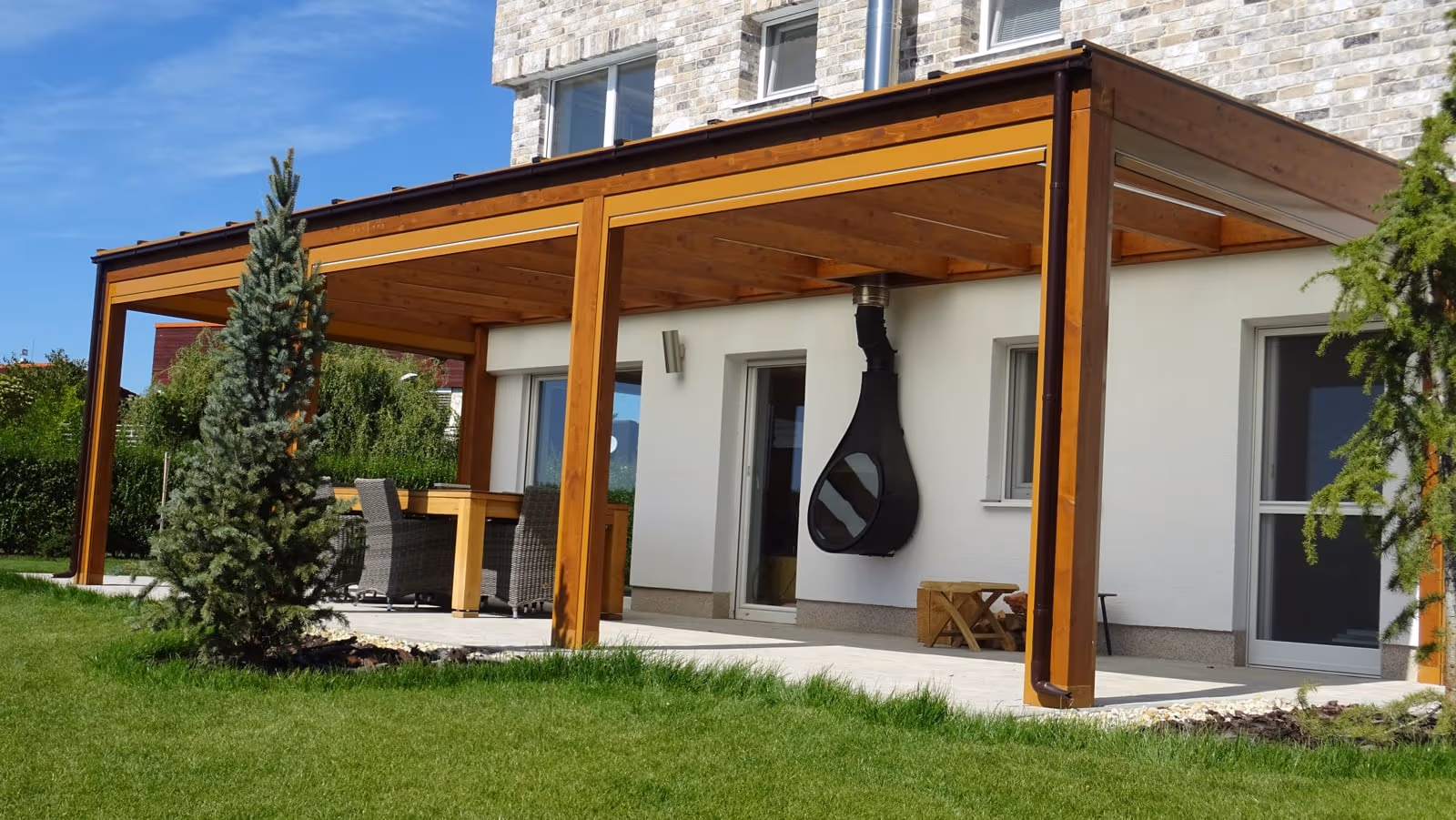 Milano wooden pergola with hidden LED lighting in an evening setting