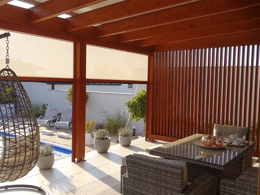 Milano wooden pergola in BSH laminated timber with seating and a pool in the garden