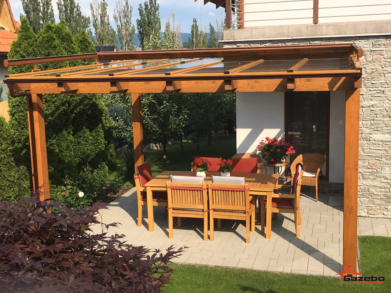 Furnished Fenix wooden pergola with a dining set