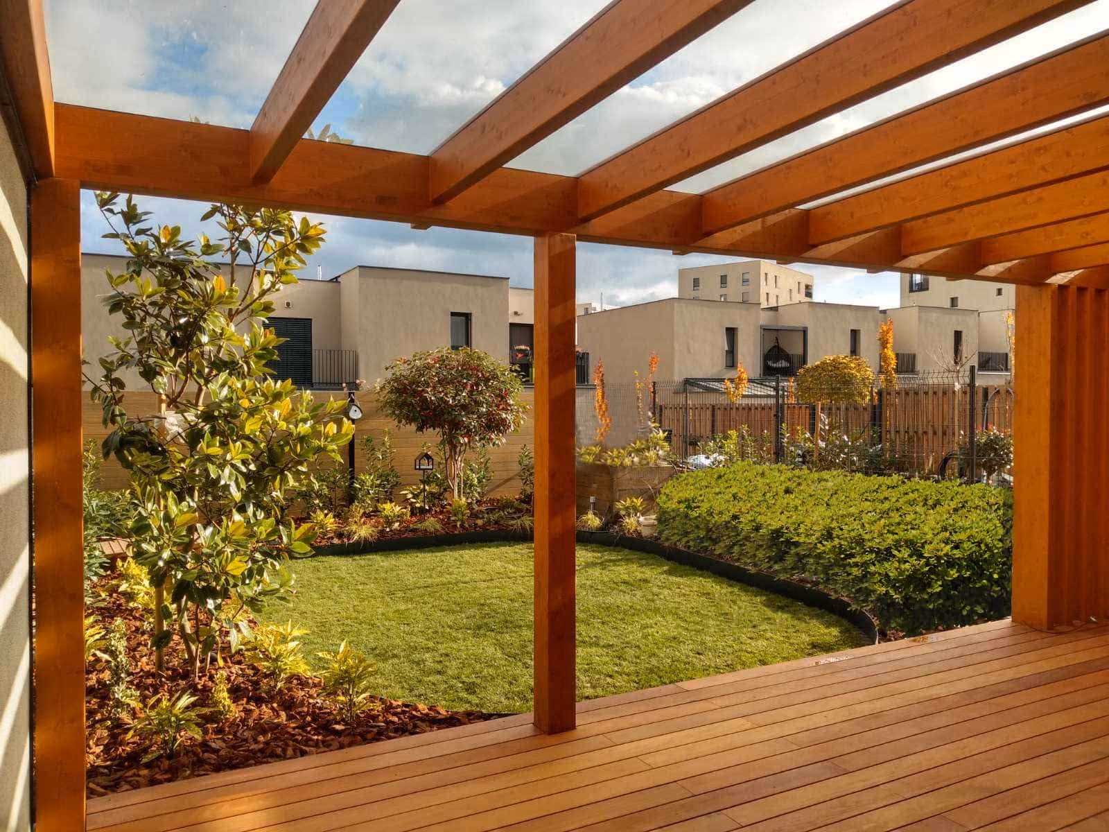 Fenix wooden pergola beside a modern family home with a garden