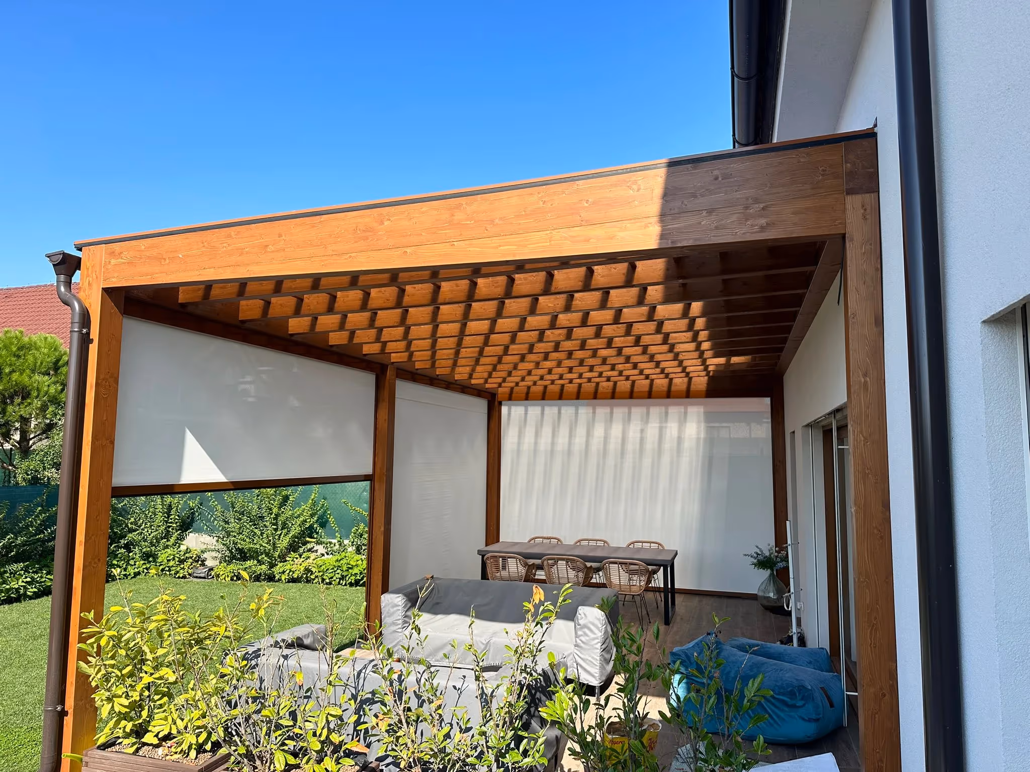 Modern Santorini wooden pergola with cross louvres in a garden